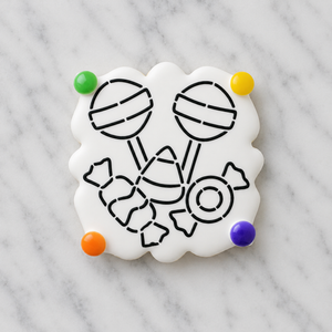 A square, plaque-shaped cookie flooded in white and decorated with the Halloween Candy PYO stenciled in black royal icing and shown with candy dots in green, yellow, orange and purple for edible cookie painting, BakeArt Stencils