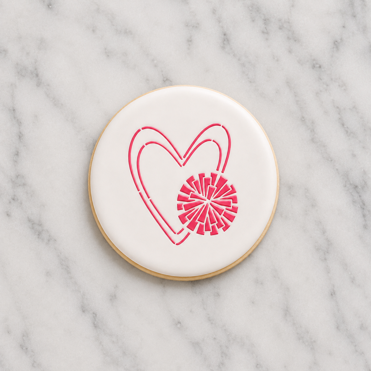 A white round cookie decorated with our Cheer Love Cookie Stencil in dark pink royal icing and show on a carrara marble counter