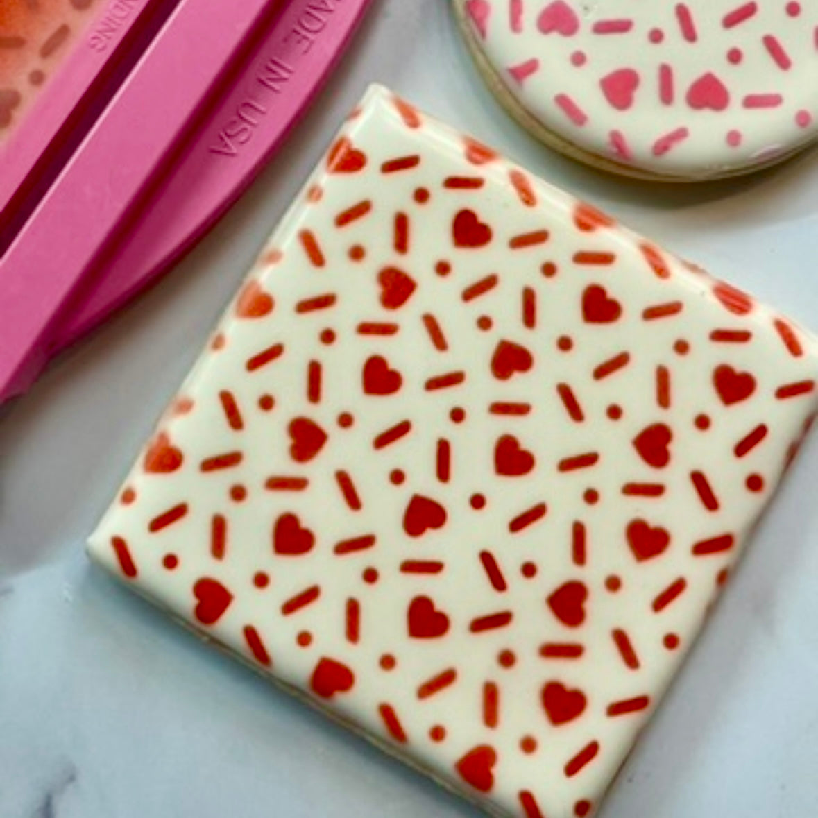 Sugar Hearts Pattern Cookie Stencil, a design of sprinkles, hearts and polka dots that is great to decorate Valentine cookies and lots more.