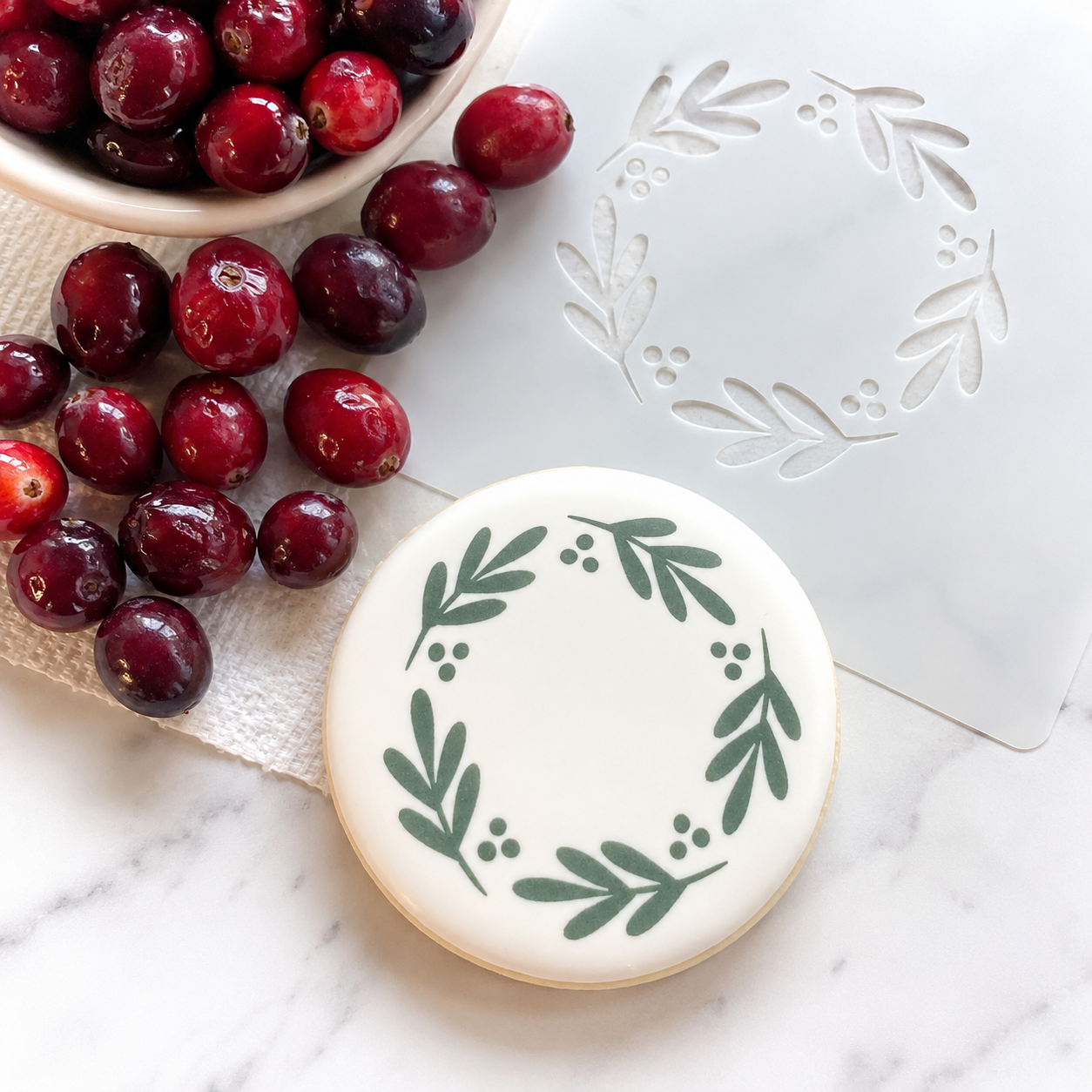 Winter Berries Border Cookie Stencil, available in three sizes for decorating round sugar cookies.