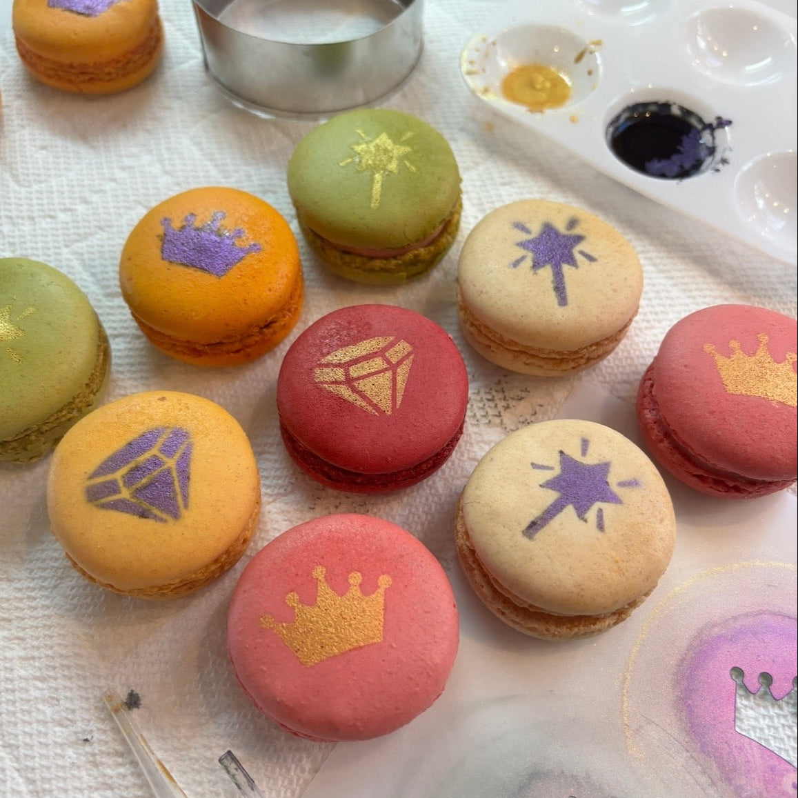 Assorted macarons decorated with tiaras, diamonds and fairy wands from the Princess Stencil.
