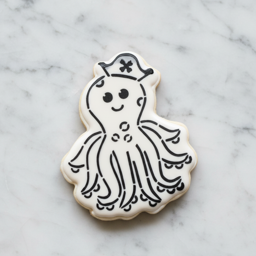 Octopus PYO cookie decorated with white royal icing and black stencil design, octopus cookie cutter and stencil set by BakeArt Stencils