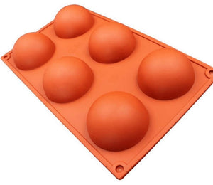 Hot Cocoa Bomb Silicone Mold, features six cavities for making hot chocolate bombs for holiday treats.